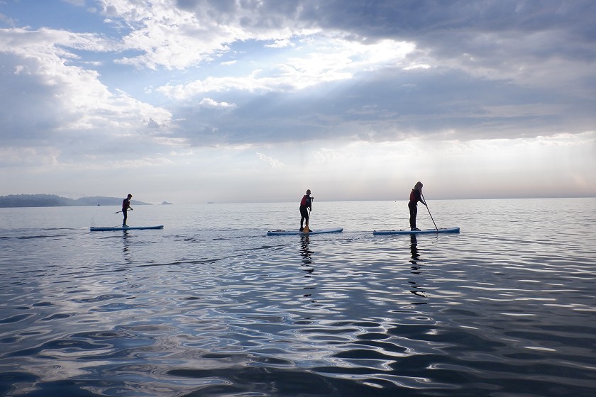 3 stand up paddleboarders